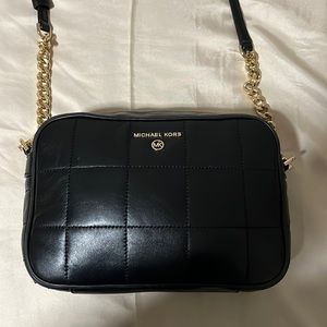 Black Michael Kors crossbody bag with removable strap. Small but very spacious.